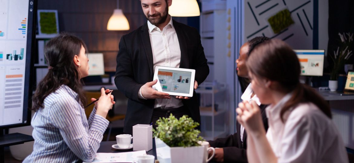 Entrepreneur businessman showing company strategy using tablet for corporate presentation